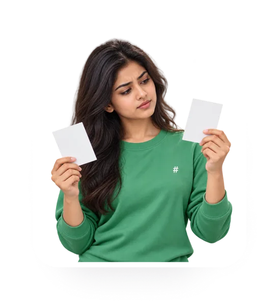 Learner in a green HashHackCode top holding two cards